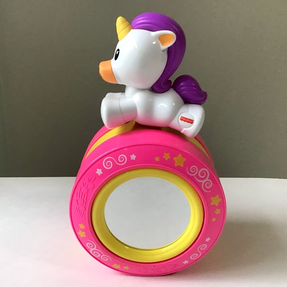 Fisher-Price Crawl Along Musical Unicorn Rocks as it Rolls Sounds & Mirror 6M+